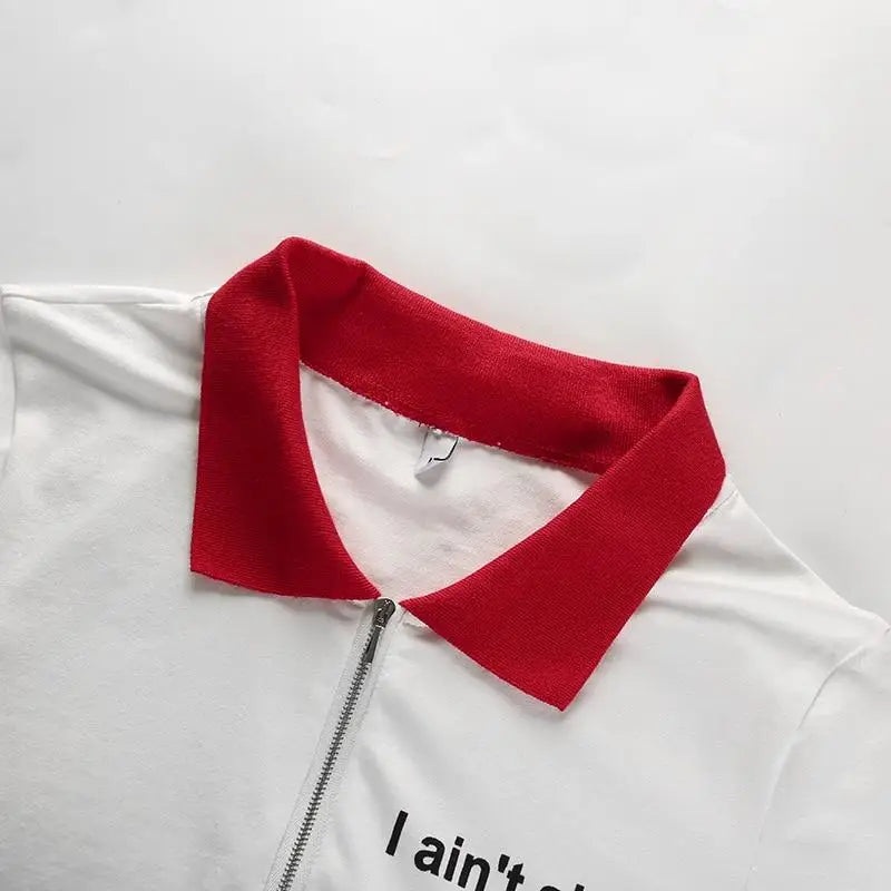 Fiesty Collared Zip Up Crop Top with I Aint Shit Design - shirt